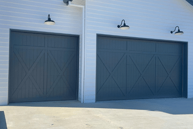 Dual custom garage doors dark blue doors one double one single