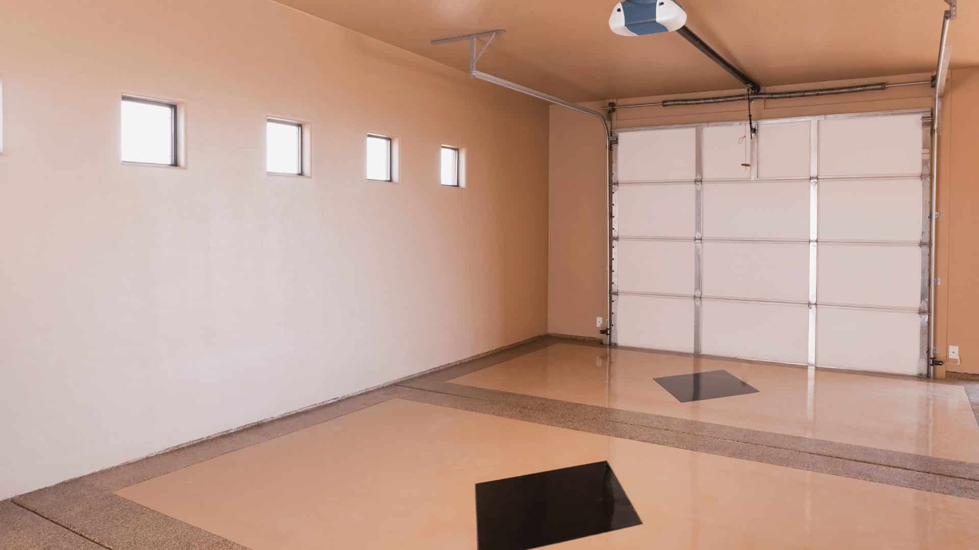 Interior view of a white sectional garage door showing the hinged panels and overhead tracks